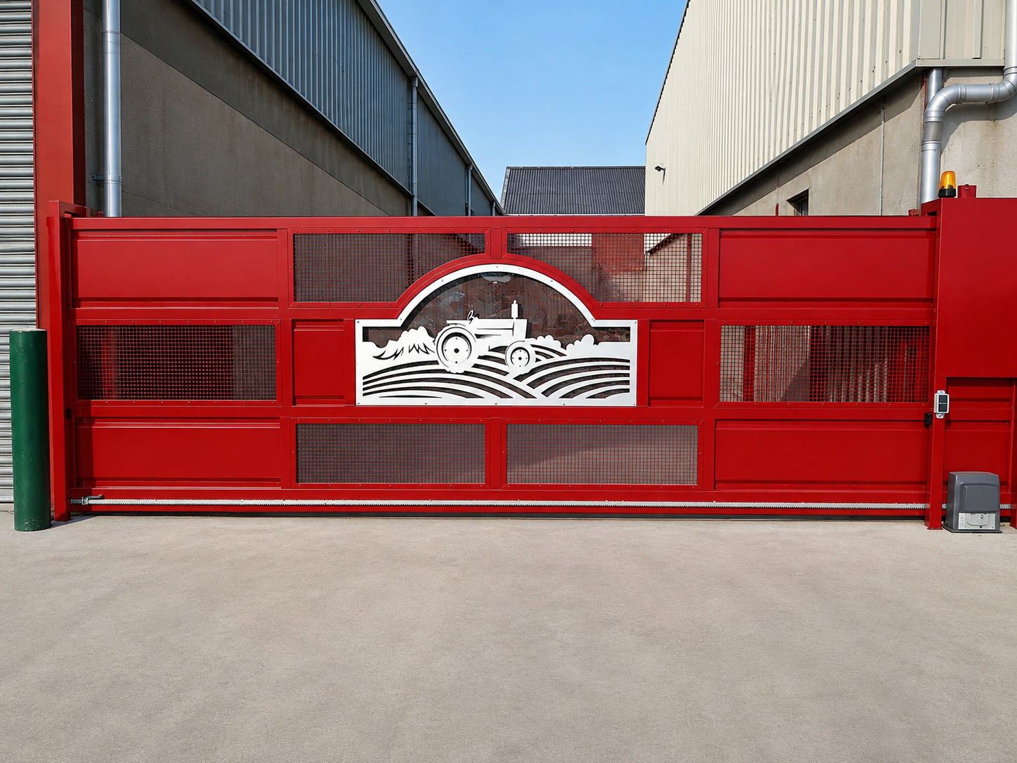 Commercial electric sliding gate with laser-cut panel at an industrial premises